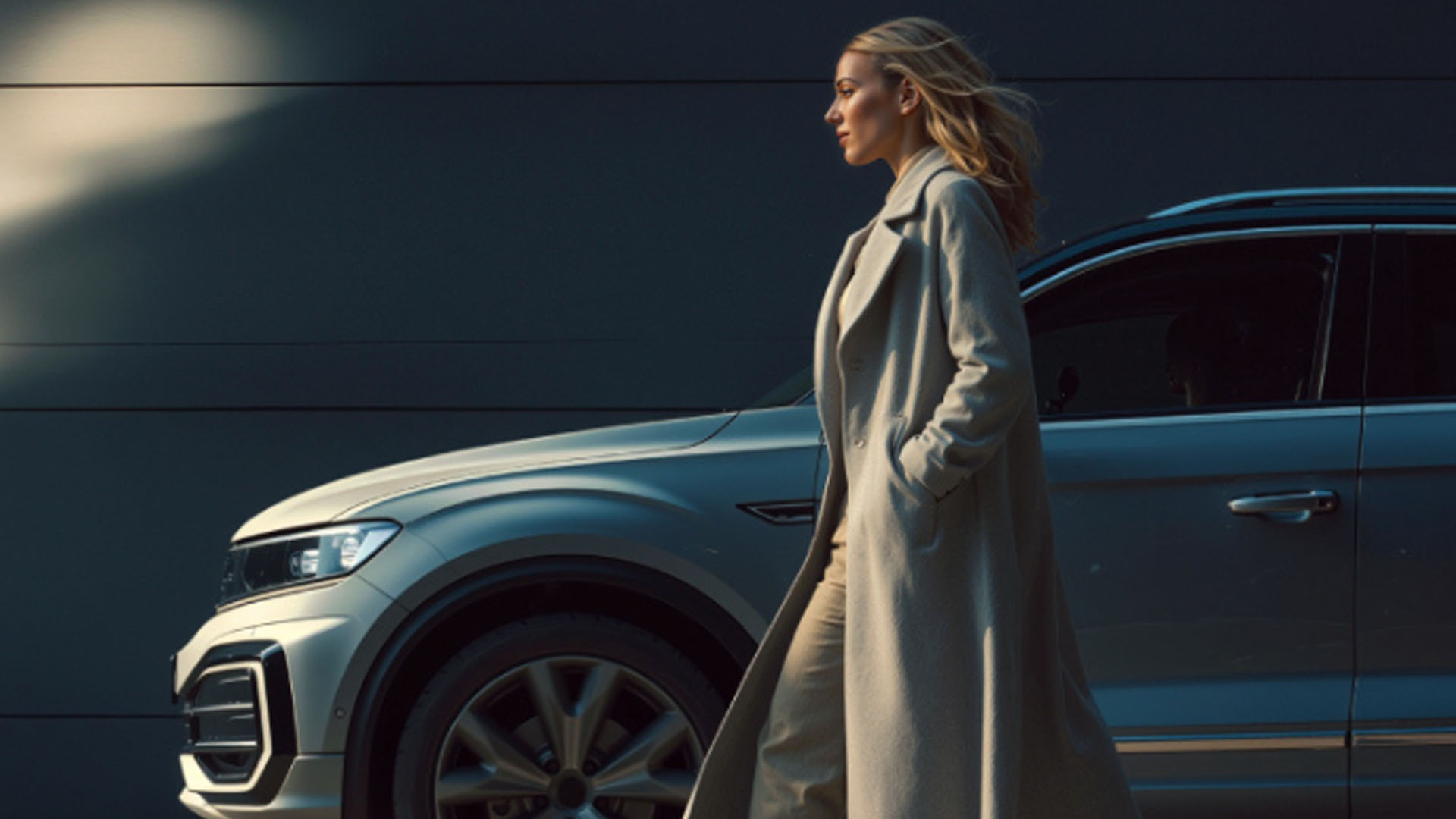 Corporate leasing vehicle with executive walking beside it